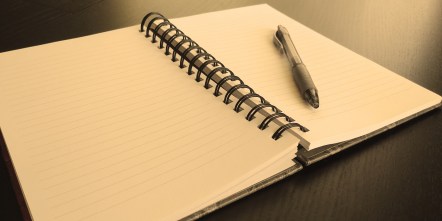 open-blank-notebook-in-sepia
